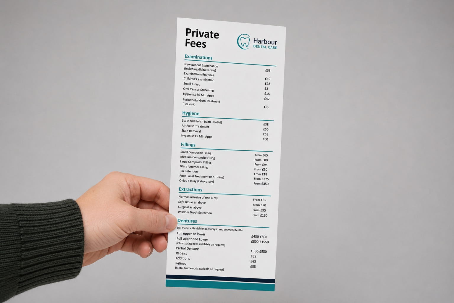 Hand holding a DL dental price list leaflet Dental practice.